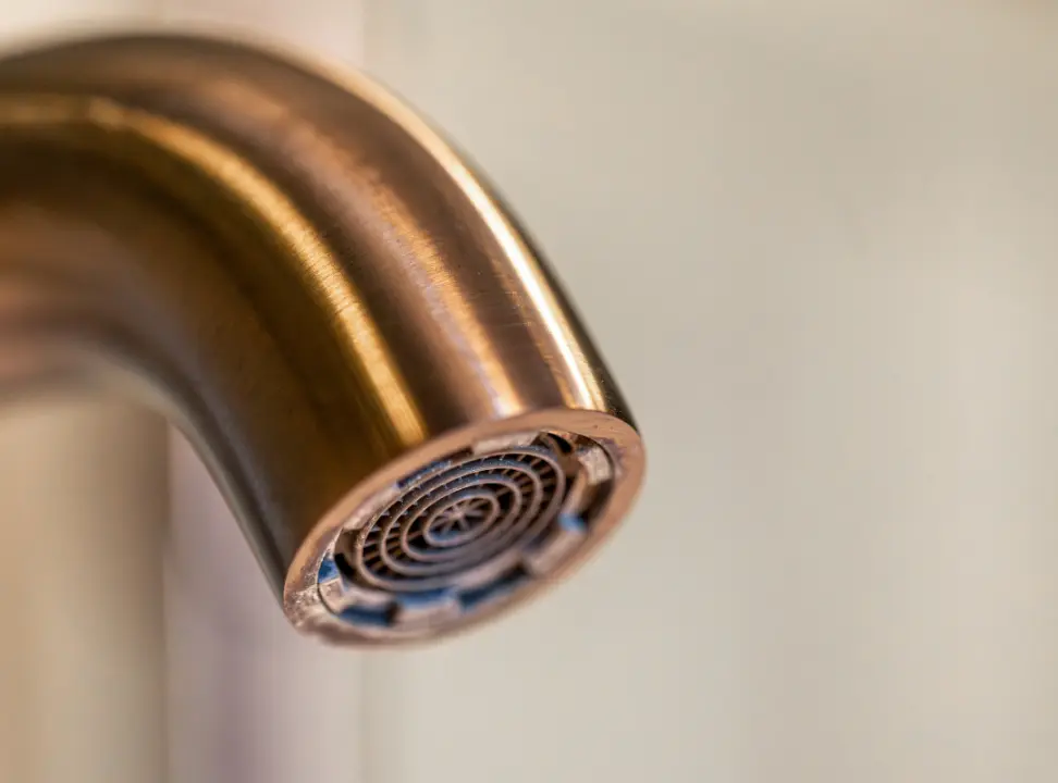 Mineral Deposit Buildup on a Faucet Aerator Screen